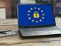 New Government Data Law set to Boost Economy. Laptop on desk showing euro lock symbol